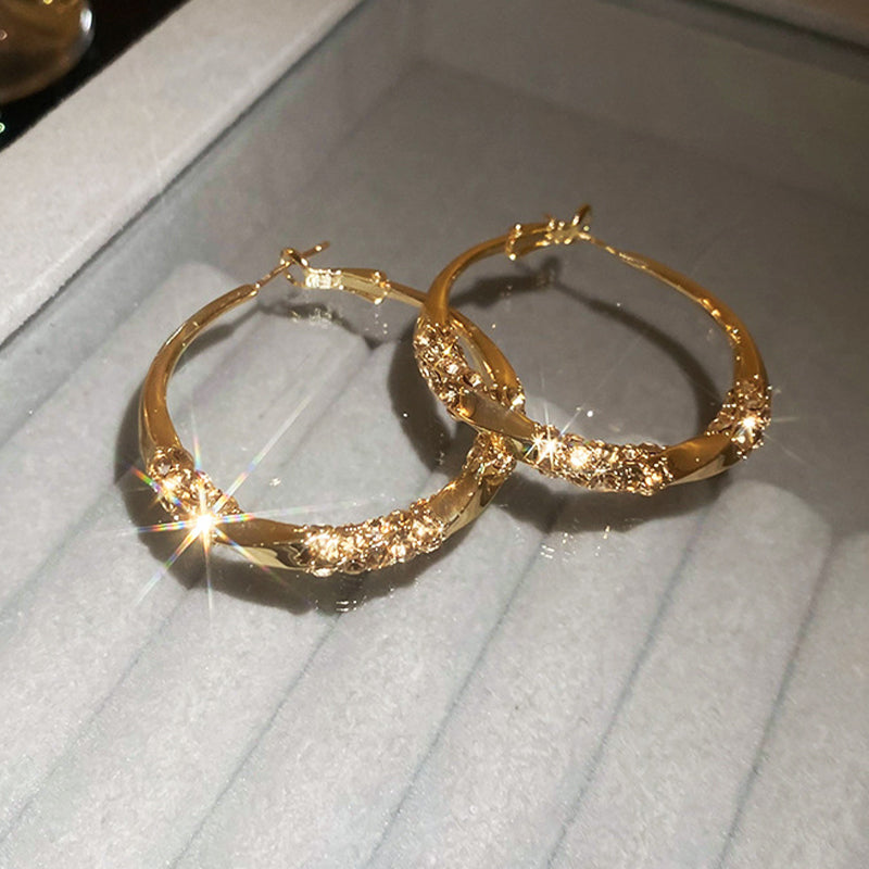 Orecchini circolari con zirconi